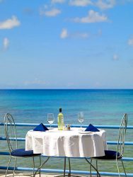 Barbados beach house dining by the sea